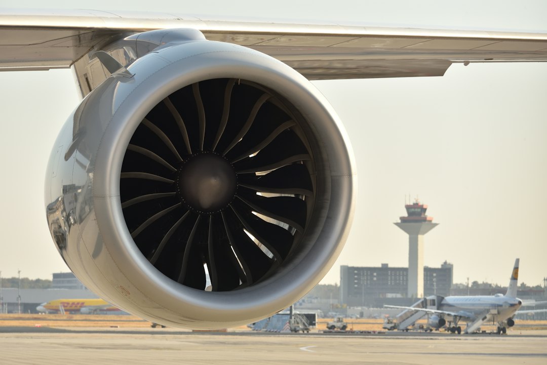 Commercial jet engine on an airport tarmac, illustrative image only and not identified as a GE Aerospace engine.